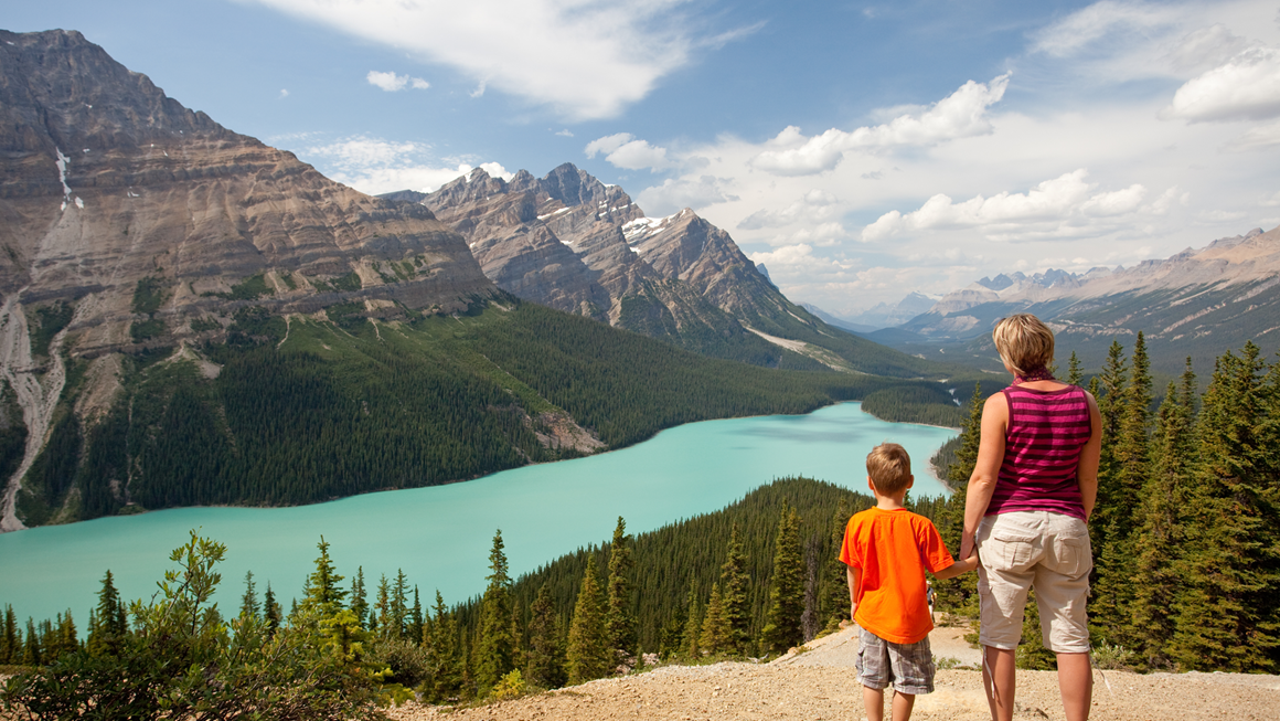 A mother and child admiring the mountain view.