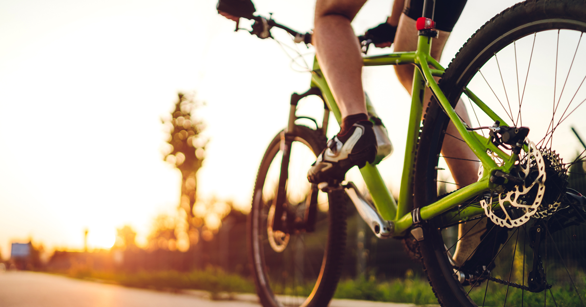 A cyclist riding a bike outdoors