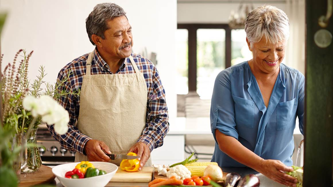 Shot of a happy senior couple cooking a healthy meal together at home