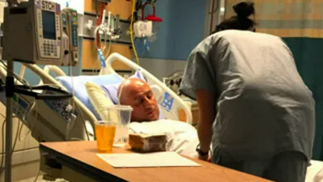 <p>Leo being attended to in the hospital after his heart attack</p>