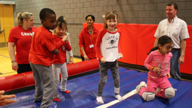 <p>Mia and friends jump on a bouncy castle at Get Moving for Heart.</p>
<p>&nbsp;</p>