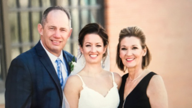 <p>Paul and Penny with their daughter Karli at her wedding.</p>