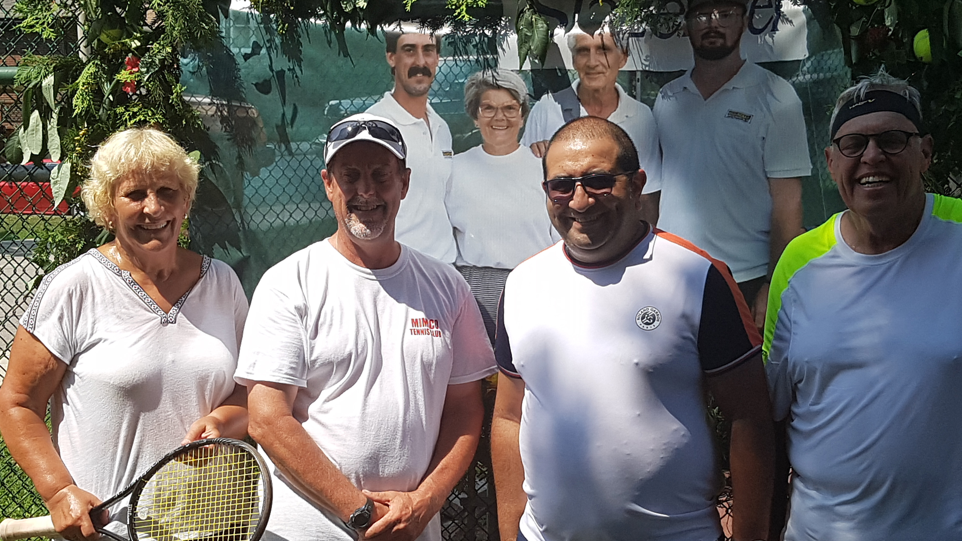 <p>Stan Palmateer (middle left) joined by supporters of his 24-hour tennis marathon</p>