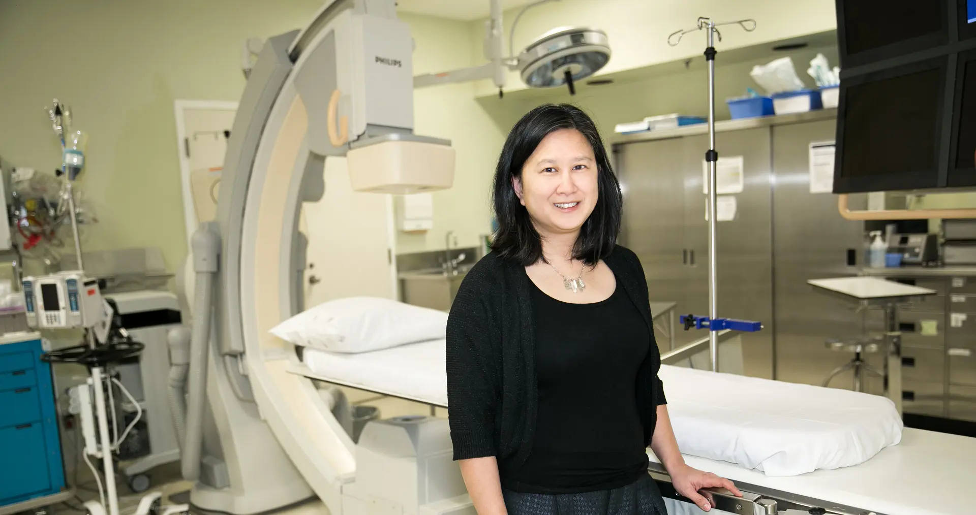 Dr. Susanna Mak in a hospital treatment room.