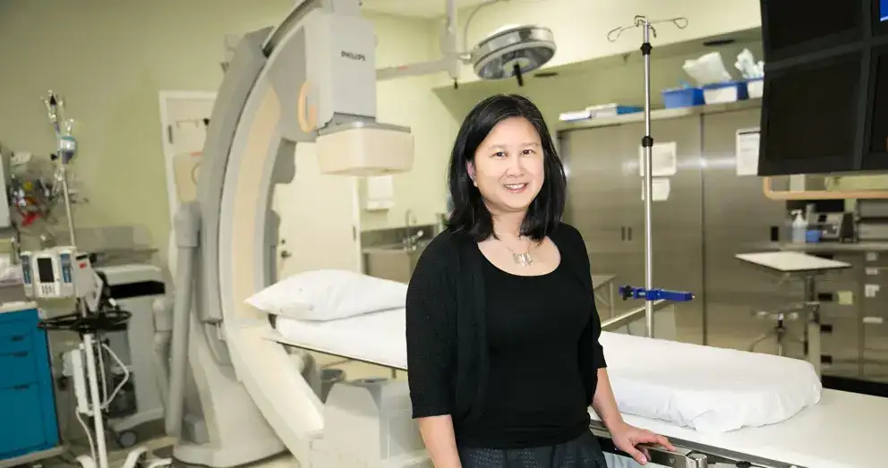 Dr. Susanna Mak in a hospital treatment room.