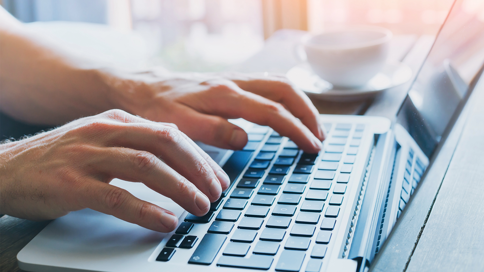 hands on the laptop typing
