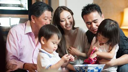 Asian family in lounge