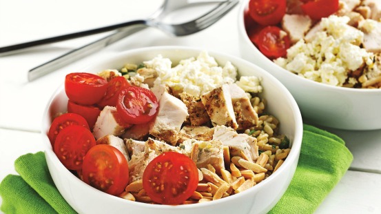 Chicken, tomatoes, feta and brown rice in a bowl