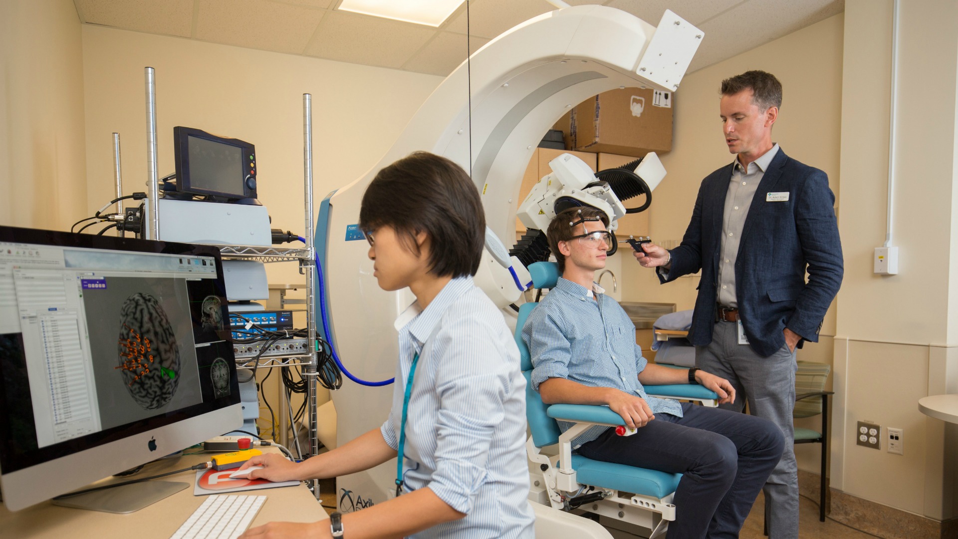 Dr. Adam Kirton working in his lab 