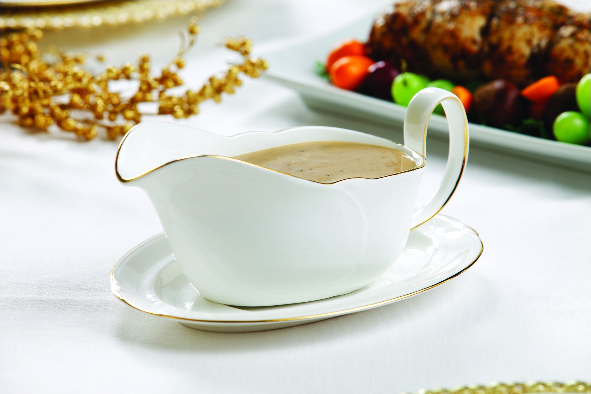 Porcini mushroom gravy in white gravy boat