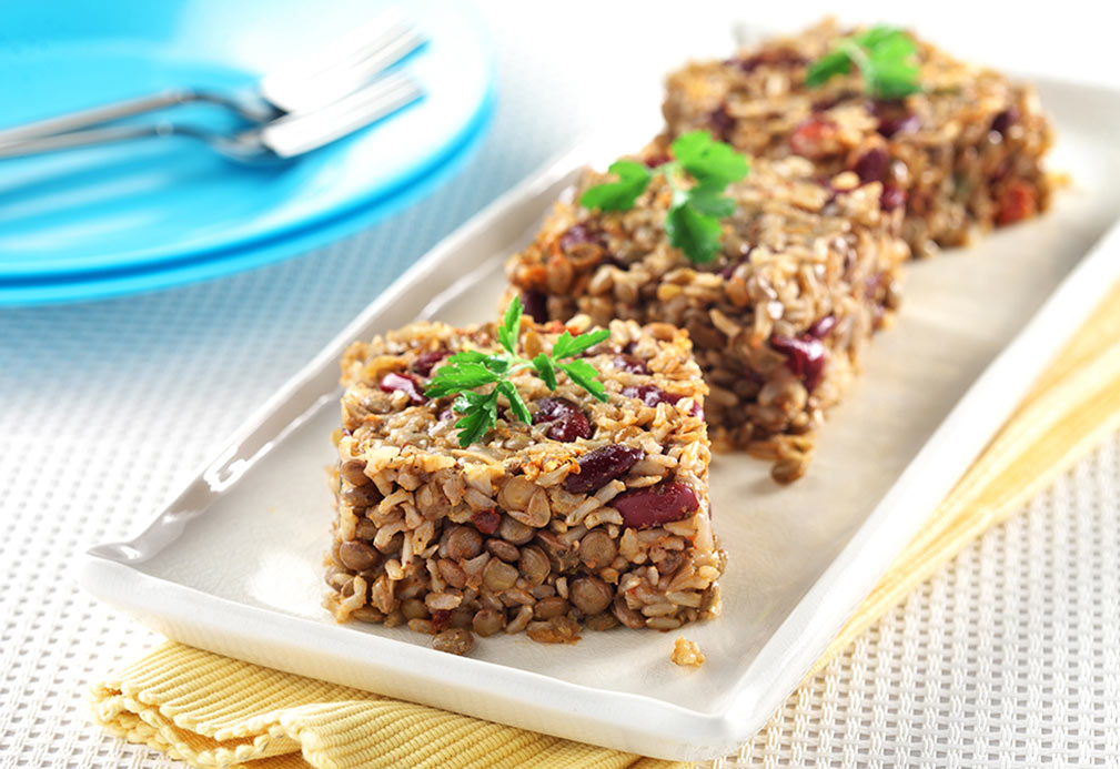 Bean, lentils and rice on white plate