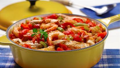 Casserole cooked shrimp, peppers, chicken and celery
