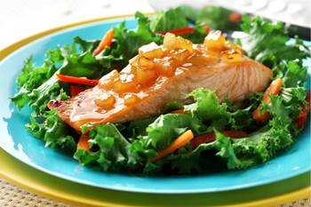 Salmon with mango chutney on bed of greens
