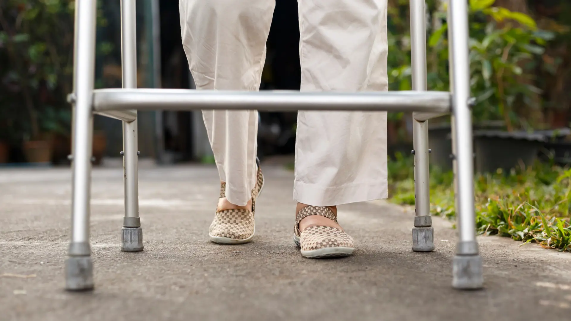 senior woman walking with walker
