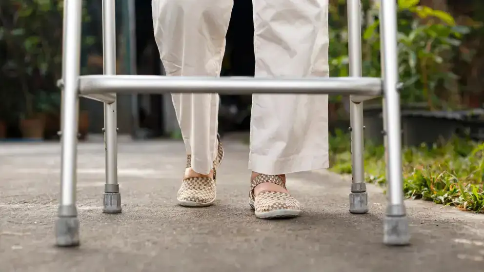 senior woman walking with walker