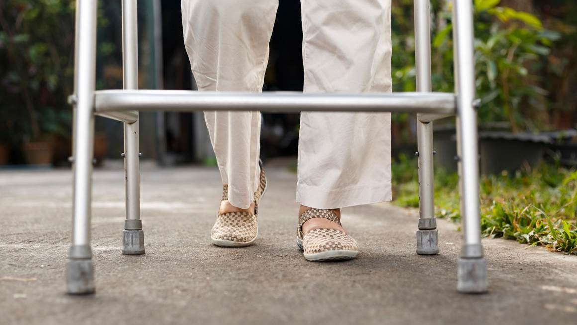 senior woman walking with walker