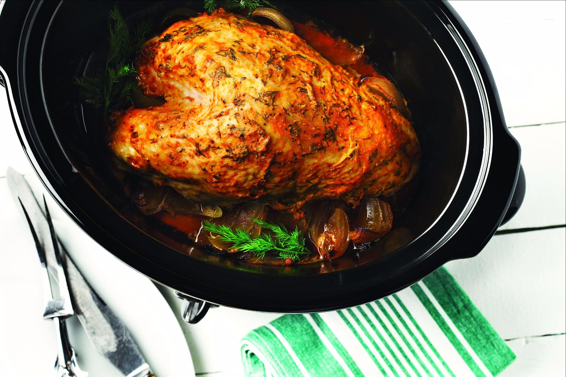 Roast turkey with dill in roasting pan