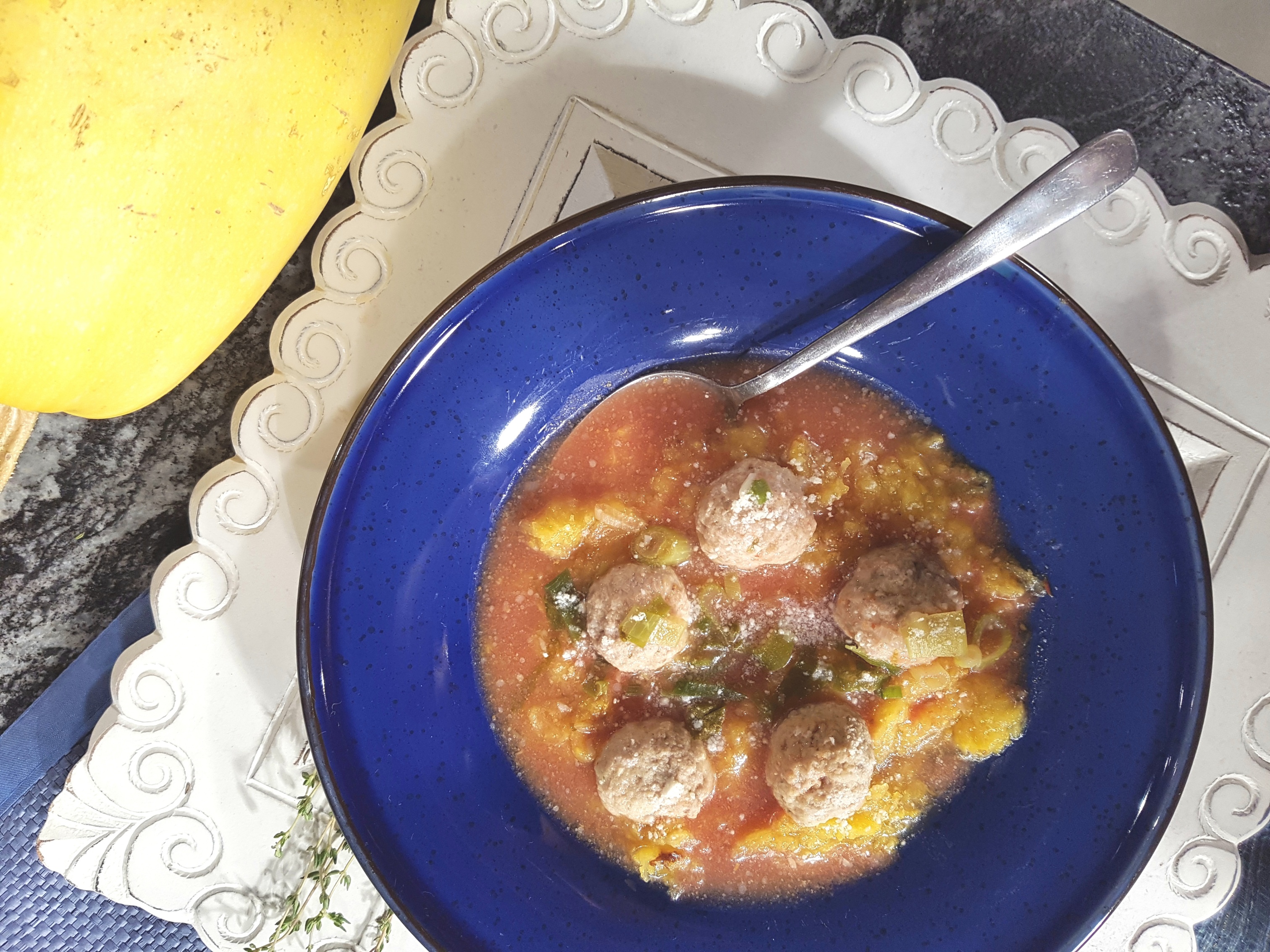 Bowl of spaghetti squash topped with meatballs