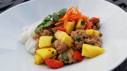 Bowl of noodles, minced turkey, pineapple, red peppers and grated carrots