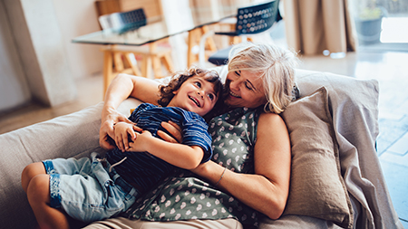 Grandma and grandson playing together at home