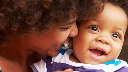 Mother bonding with her son sitting in a hammock
