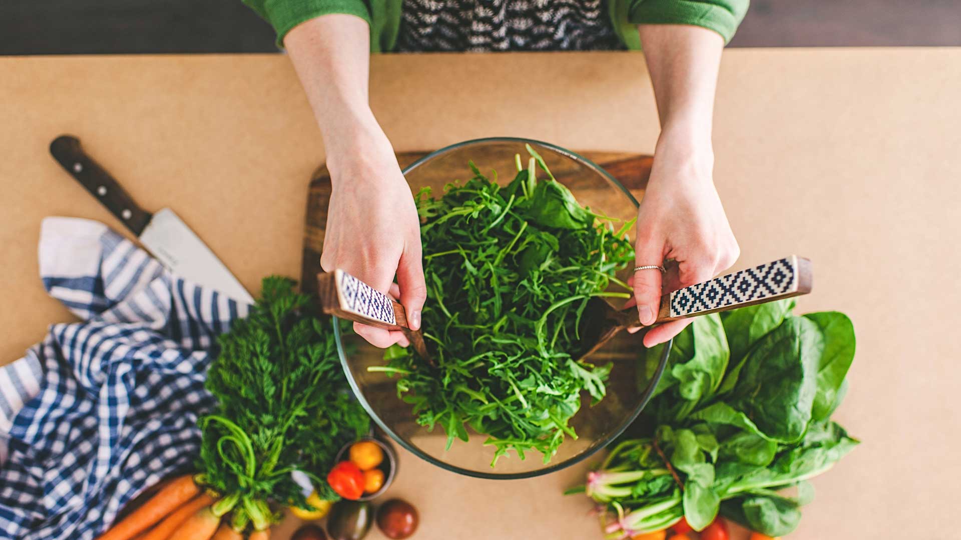 Woman making salad