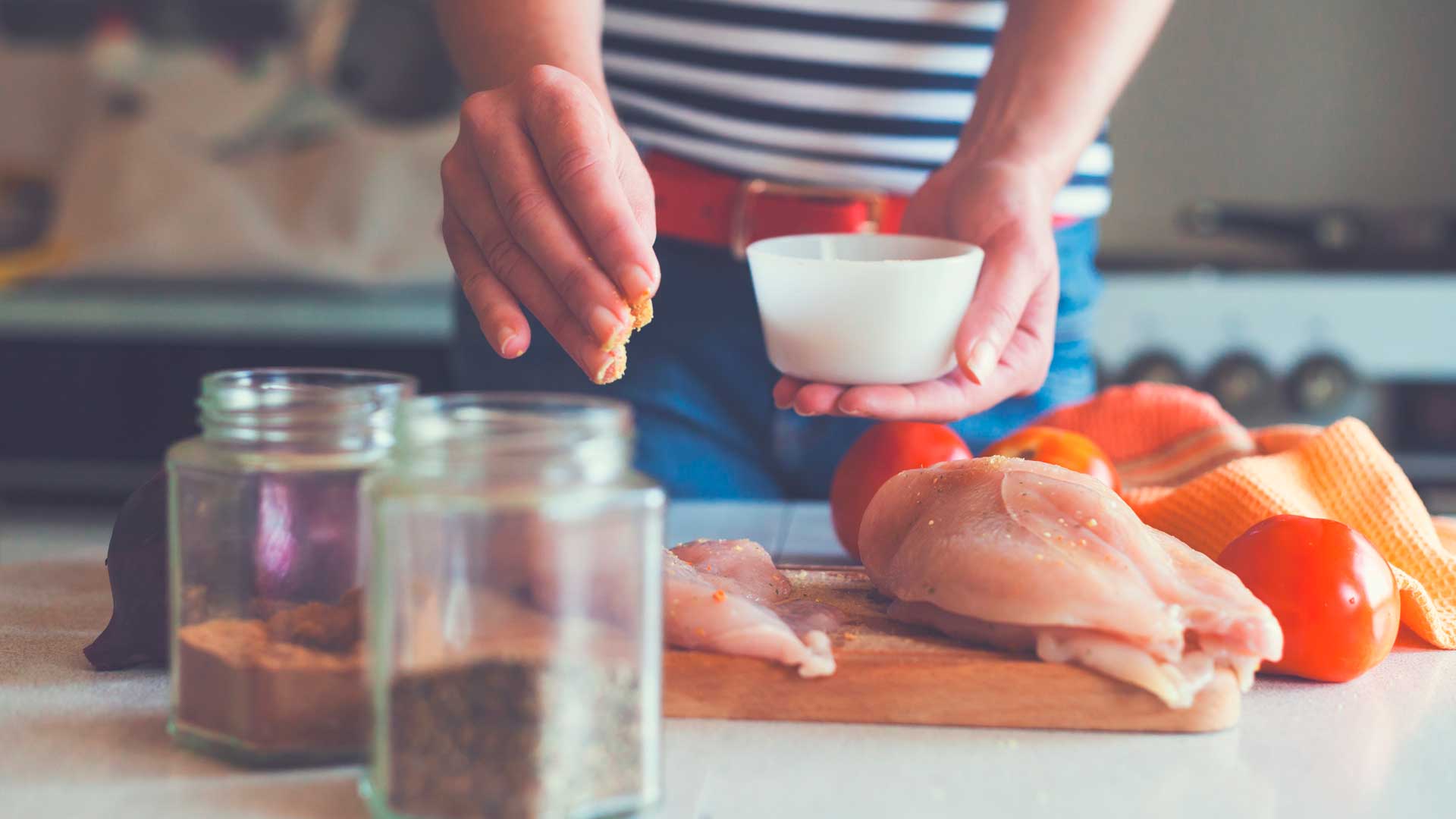 Woman making chicken dish