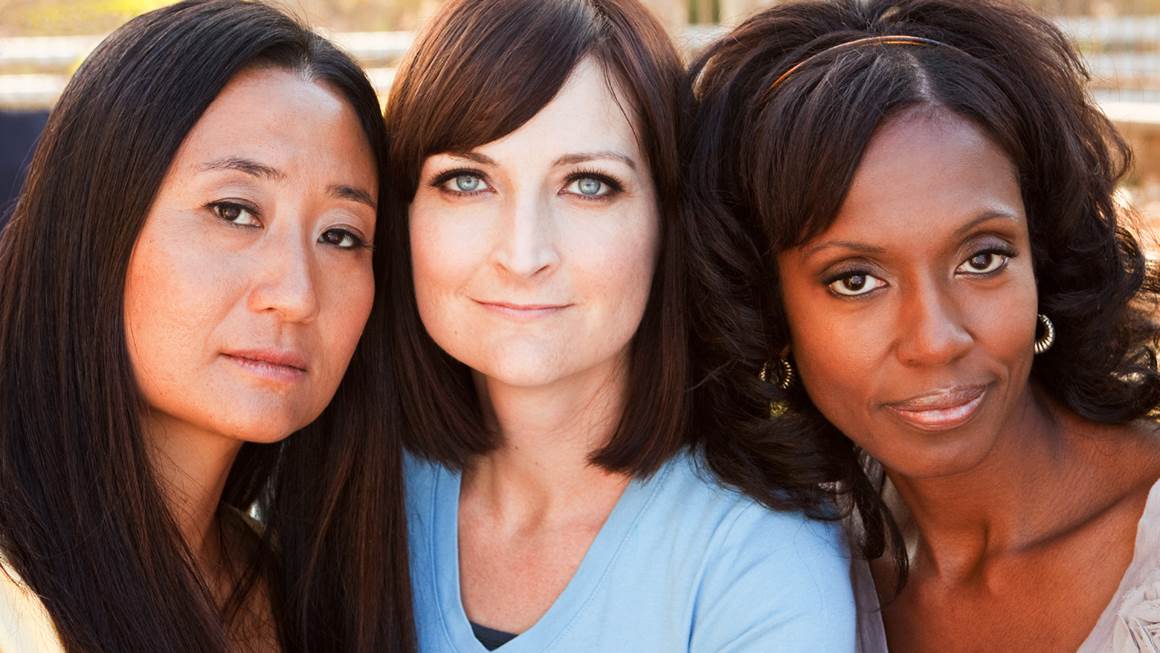 Three women of different races in close up