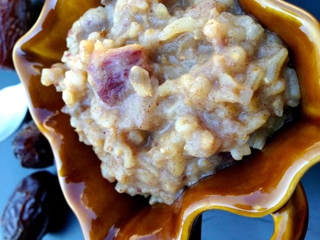 Almond cardamom rice pudding in a decorative bowl.
