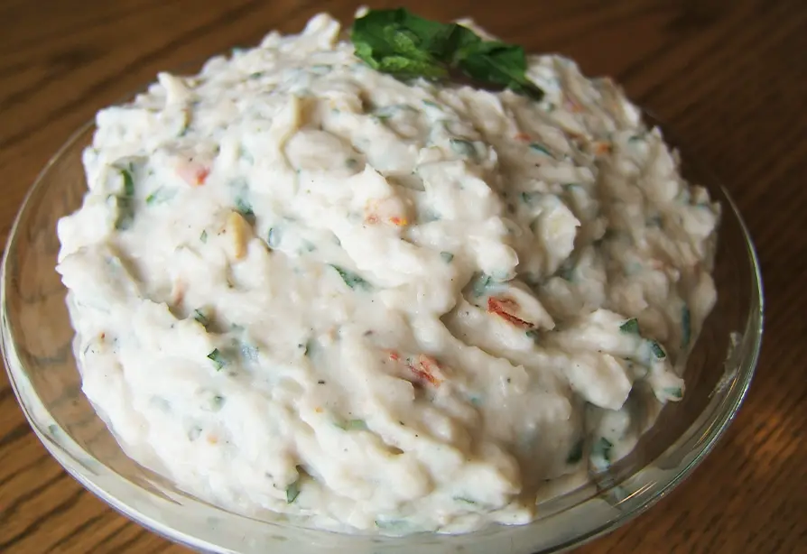 Goat cheese mint bean spread in a glass bowl.
