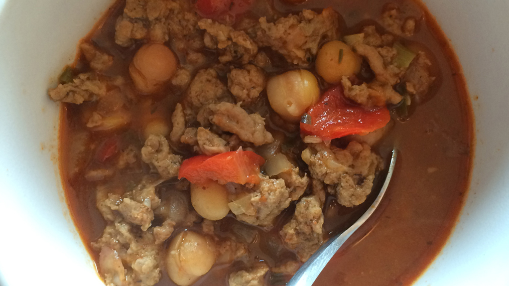 Easy chili taco filling in a white bowl with a spoon