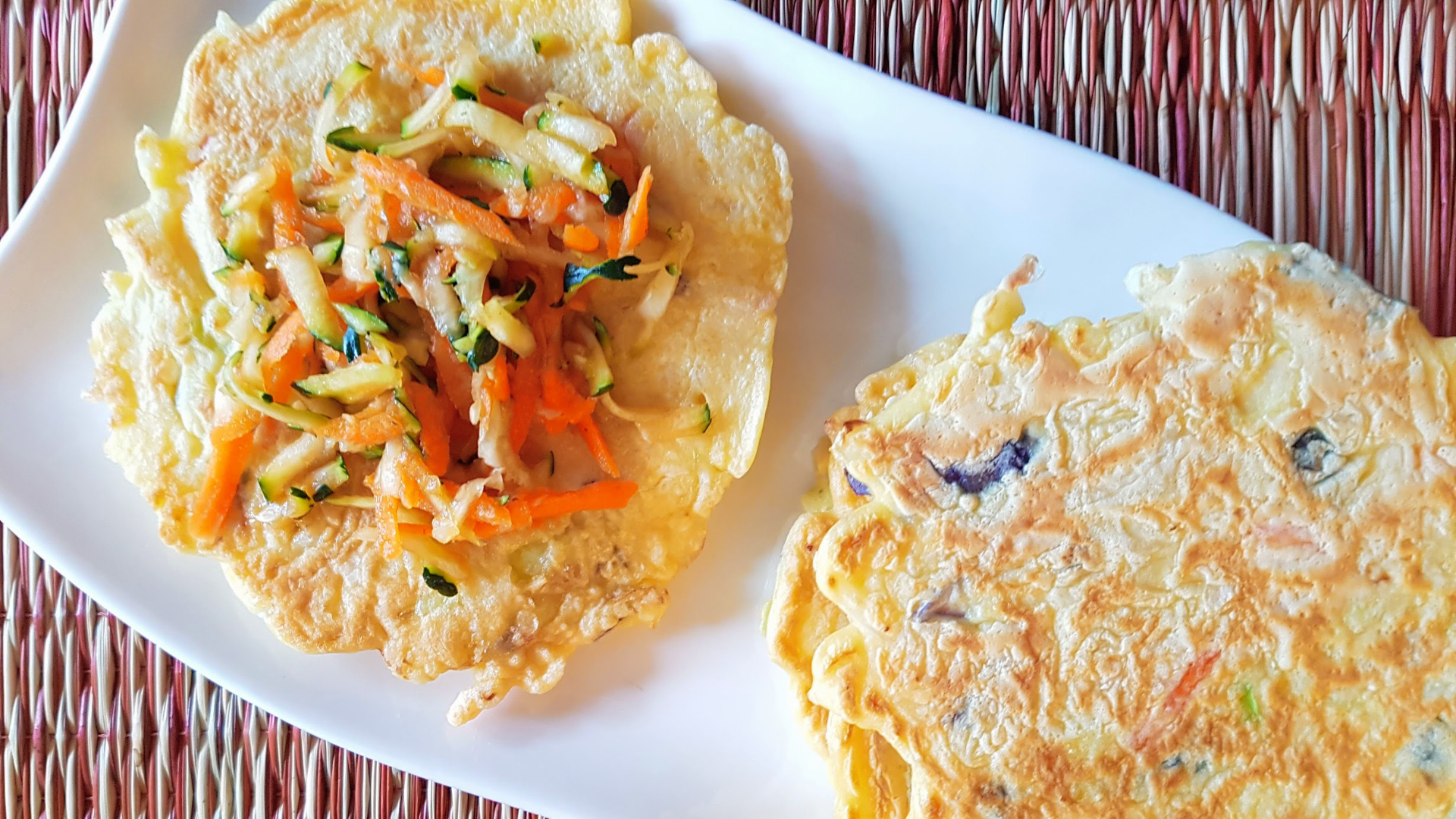 Two Japanese inspired savoury pancakes on a plate