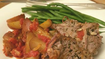 roast lamb, roasted potatoes with tomato and green beans