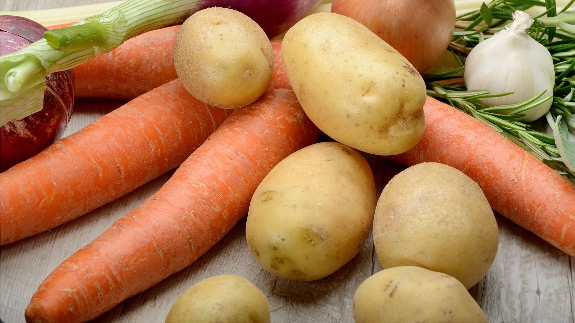 Raw carrots, potatoes and garlic
