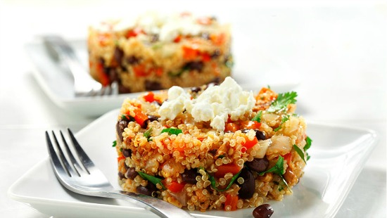 skillet quinoa with black beans and feta on a white plate