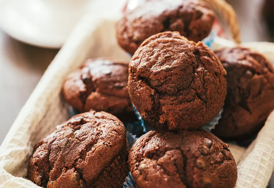 A basket of mocha cherry barley muffins.