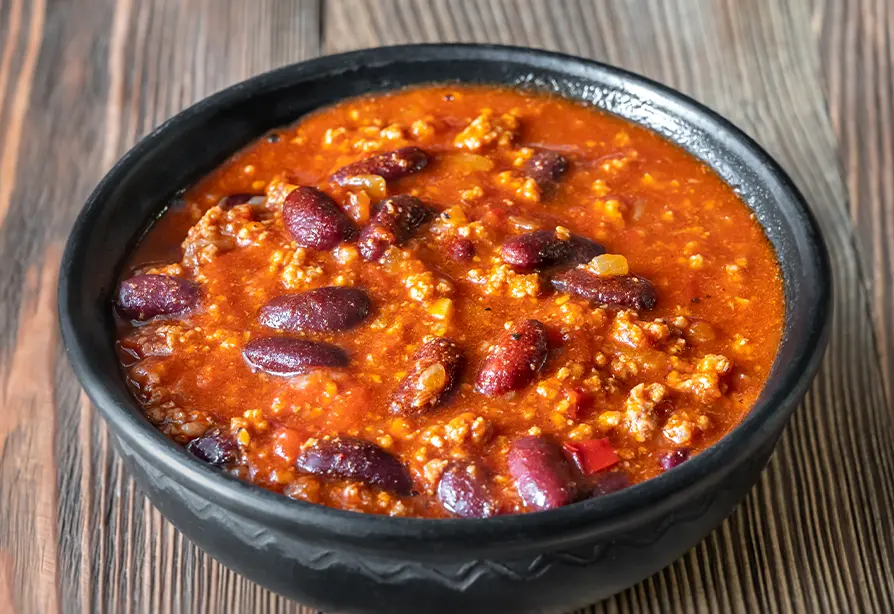 A bowl of chili with beans