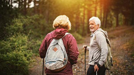 Senior couple hiking in the forrest