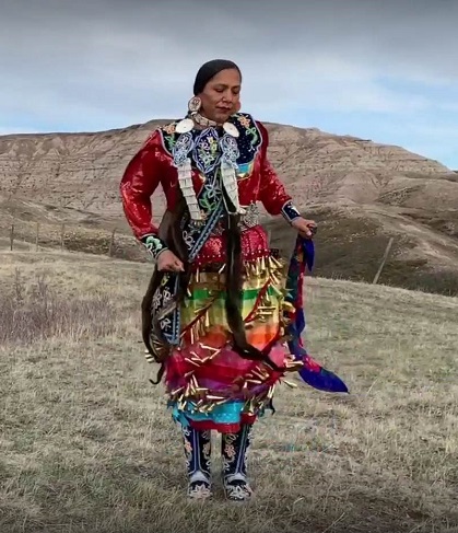 Paula Weasel Head performs Jingle Dress Dancing