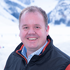 Jon Faber in front of snow covered mountains