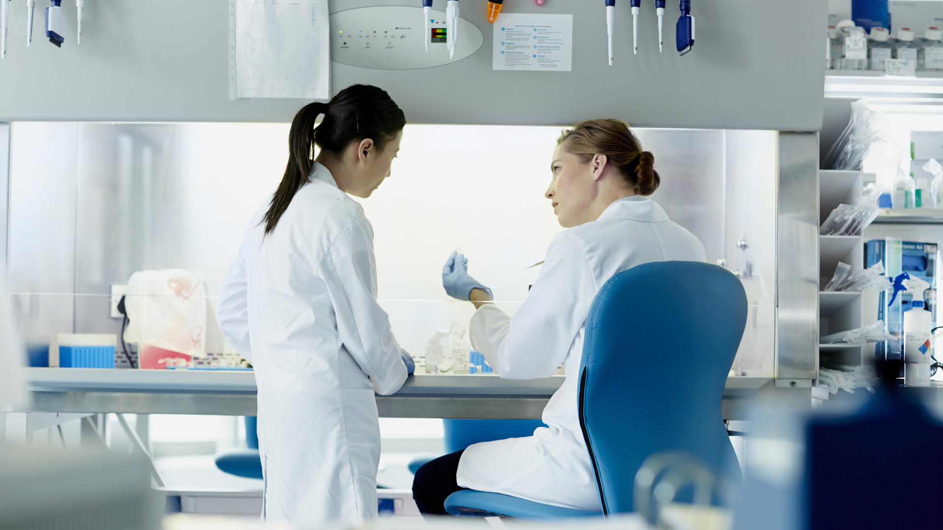 Two female researchers working in lab