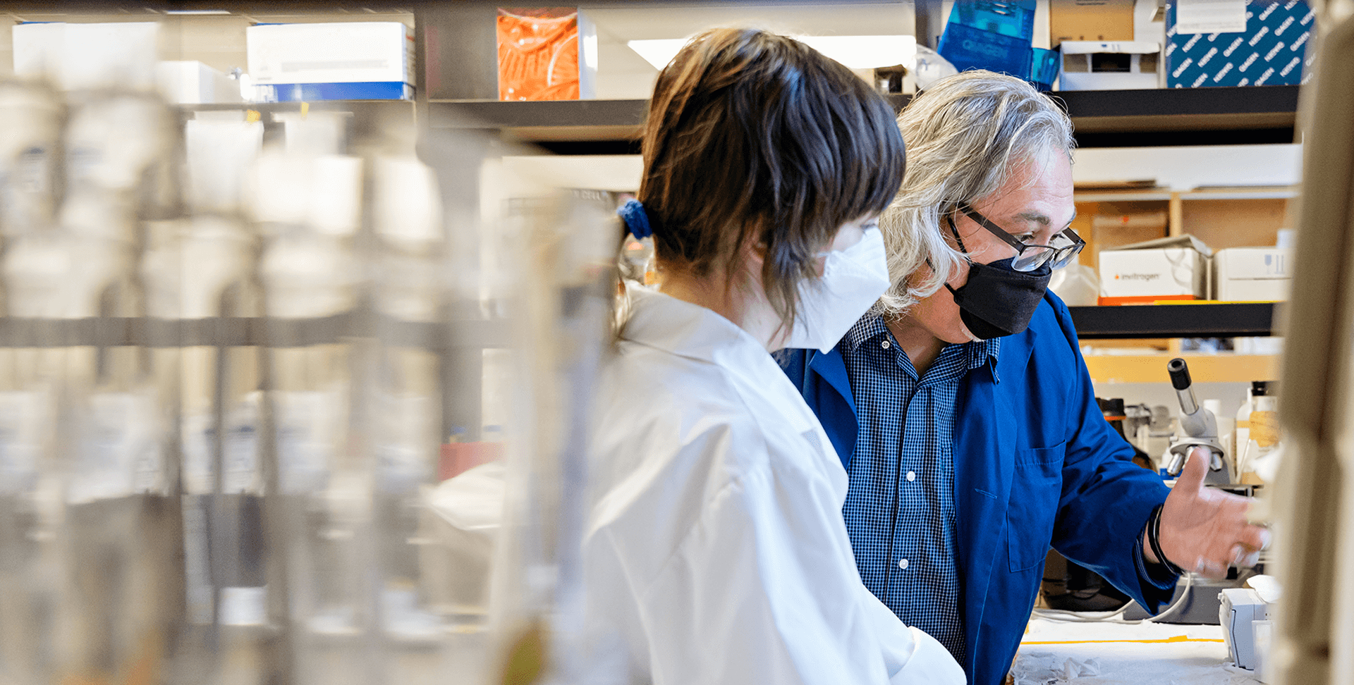 Dr. Glen Pyle talking to a member of his research team