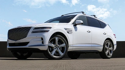 A white Genesis GV80. 