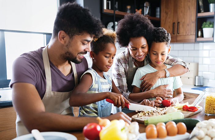 Family of 4 enjoying a wholesome, nutritious breakfast at the table.