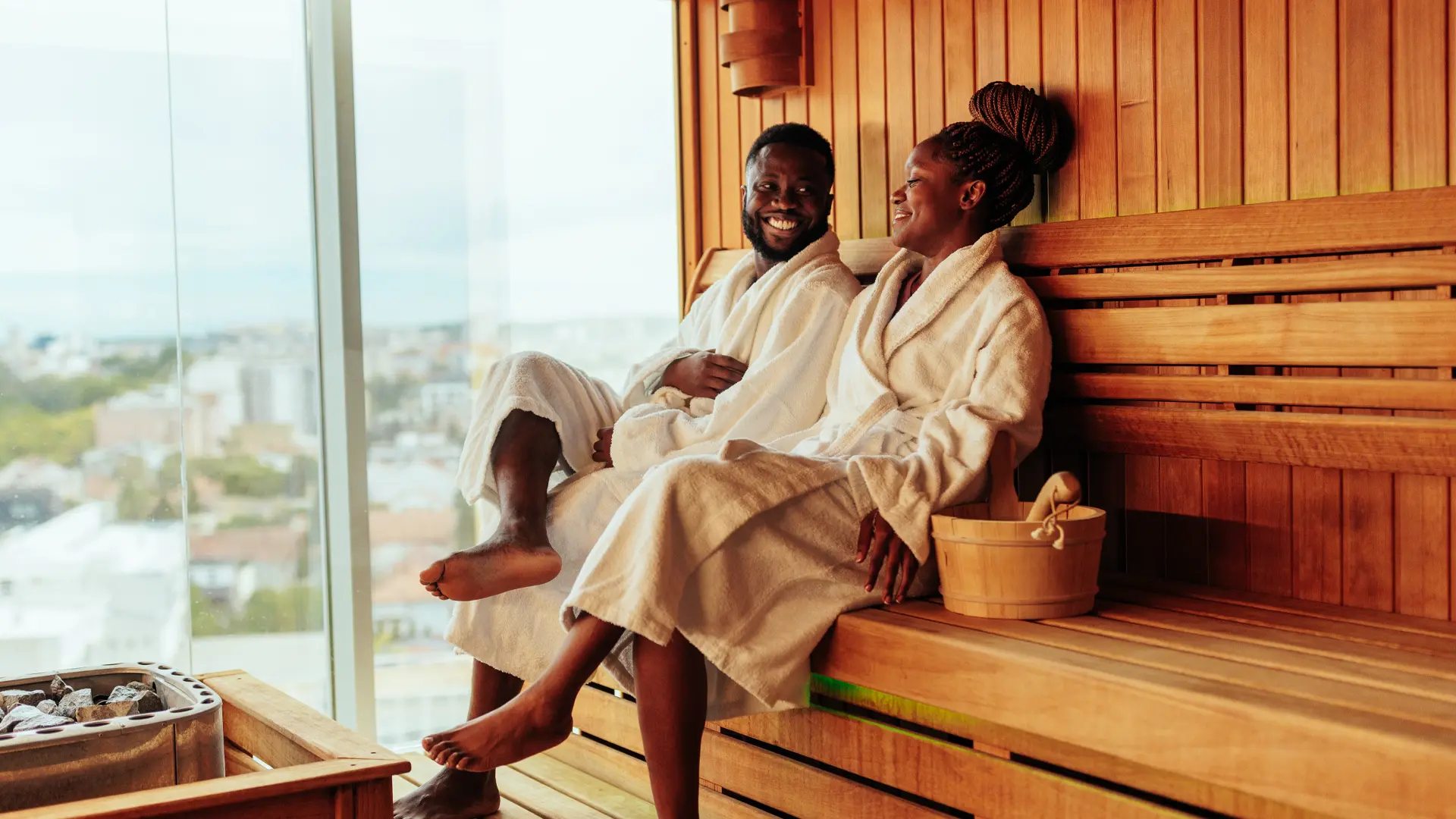 A couple relaxing in a sauna.