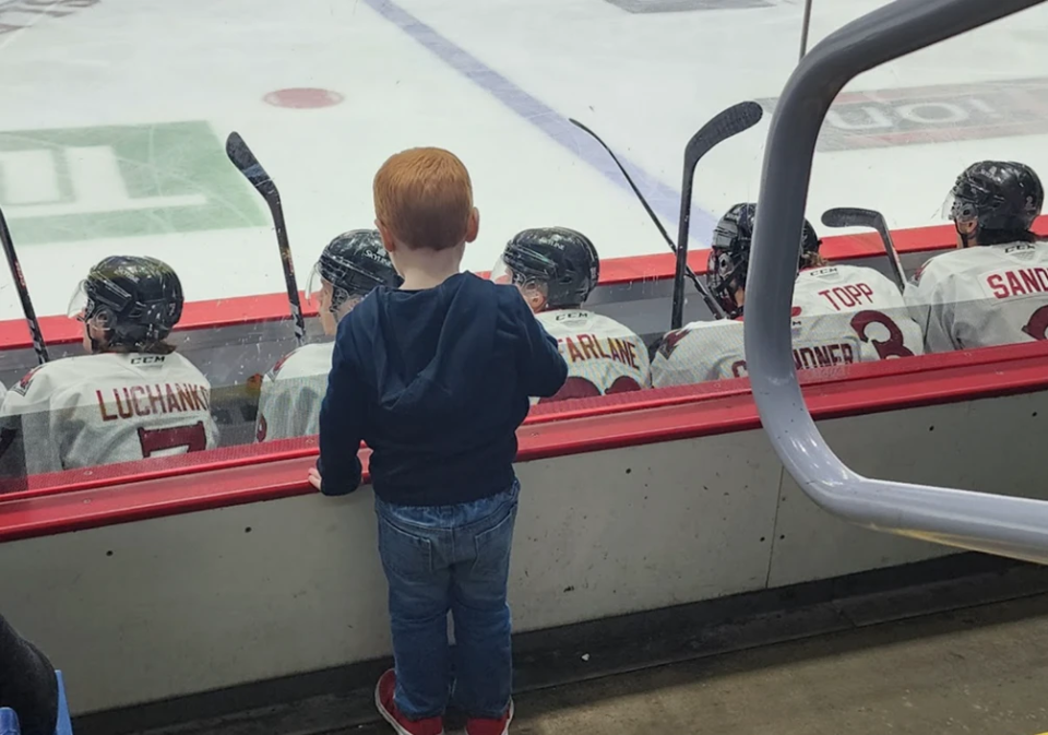 Charlie going to his first hockey game. 
