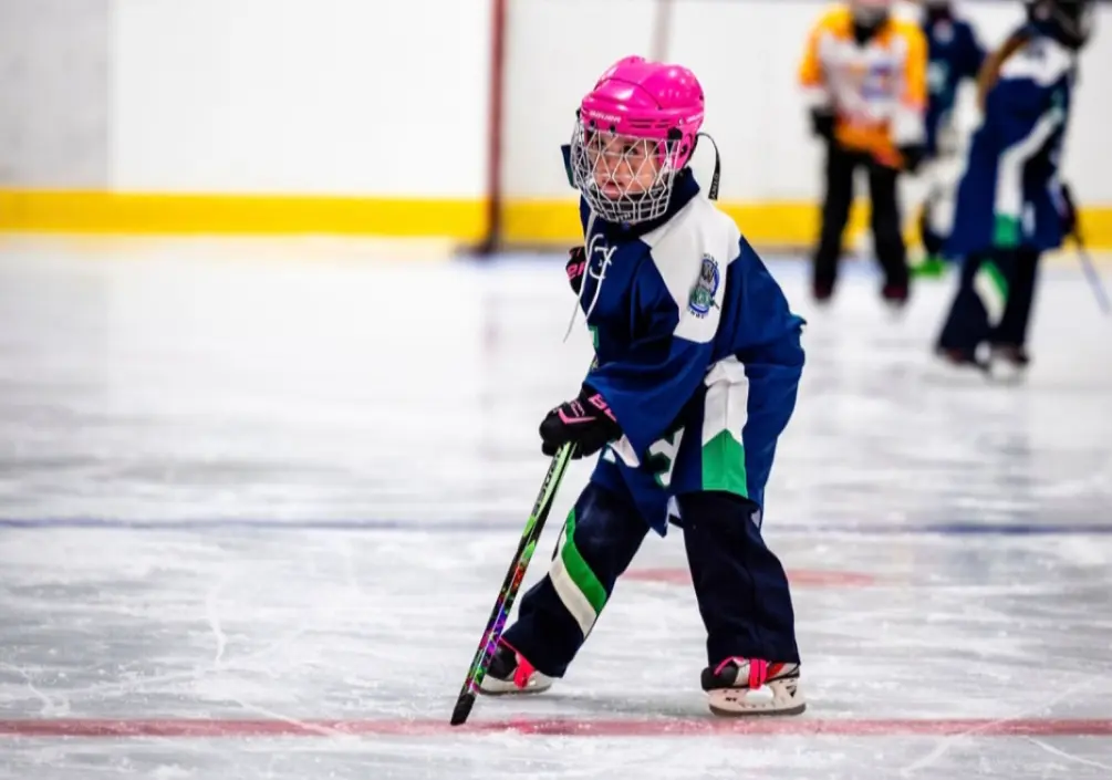Natalie playing hockey with her friends.