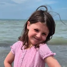 Natalie soaking up the sun at the beach. 