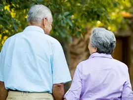 A couple holding hands.