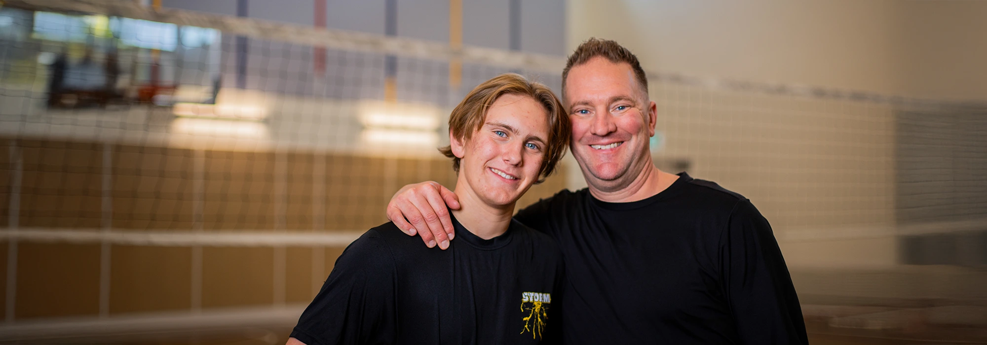 Father and son, Mike and Max, smile for the camera.